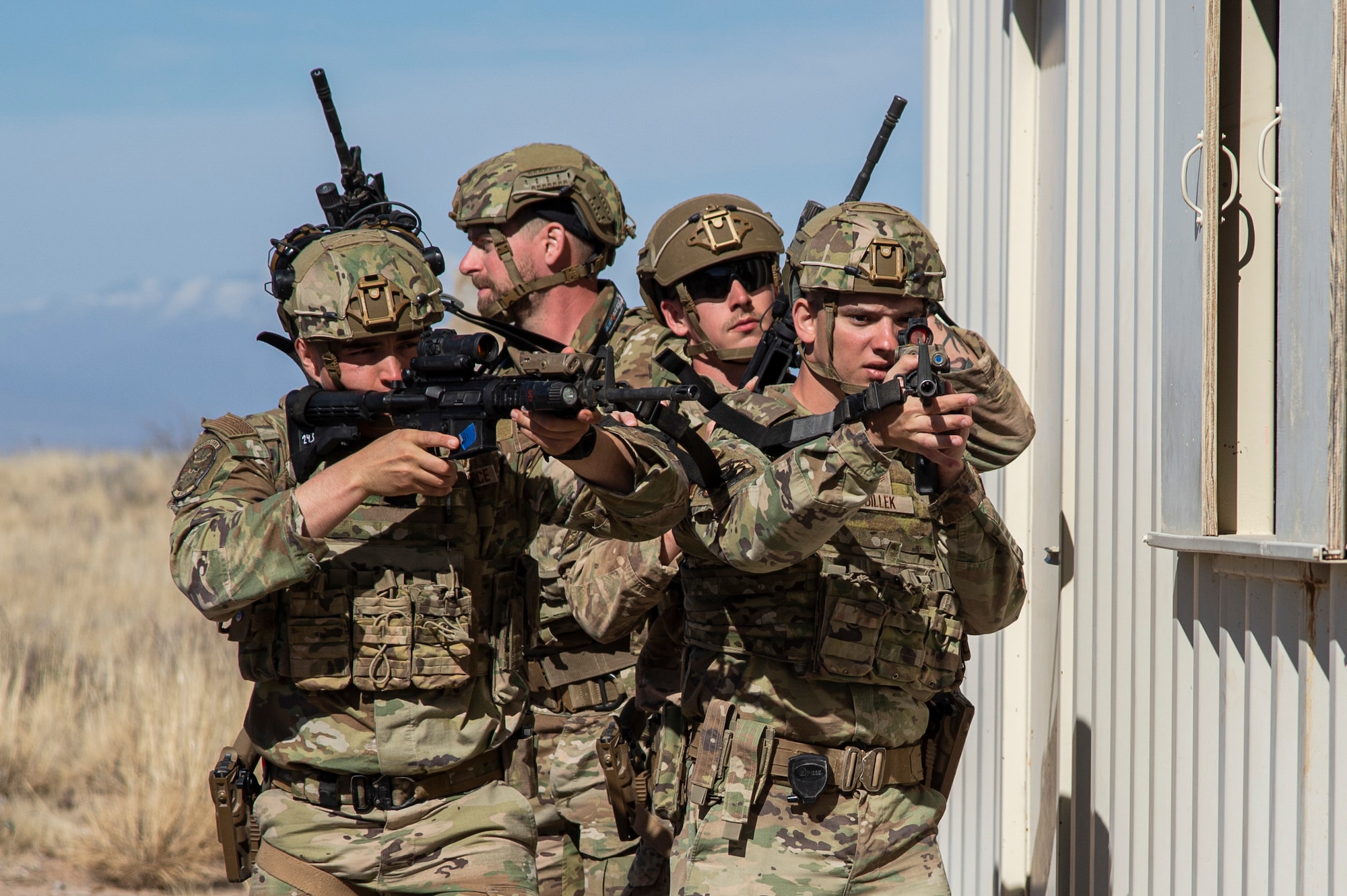 Airmen from the 49th Security Forces Squadron practice small unit tactical movements during the first-ever-ever Fire Team Leaders Course at Holloman Air Force Base, New Mexico, Feb. 28, 2023. The FTLC course allowed Airmen to learn the basics of breaching entryways with specialized equipment along with the foundational steps to effectively conduct close-quarters combat. (U.S. Air Force photo by Senior Airman Antonio Salfran)
