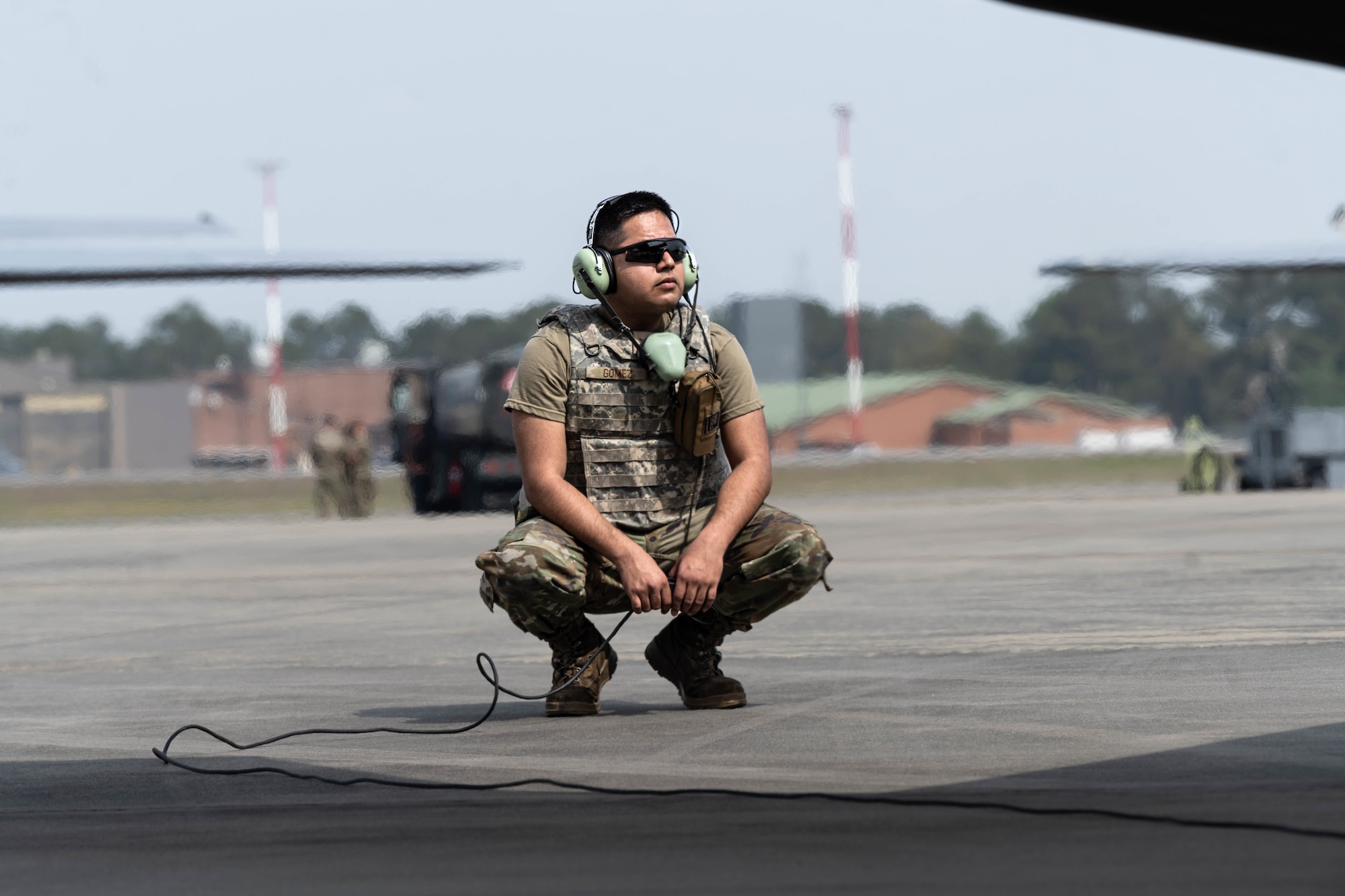 A photo of an F-35 maintainer preparing to launch a jet.