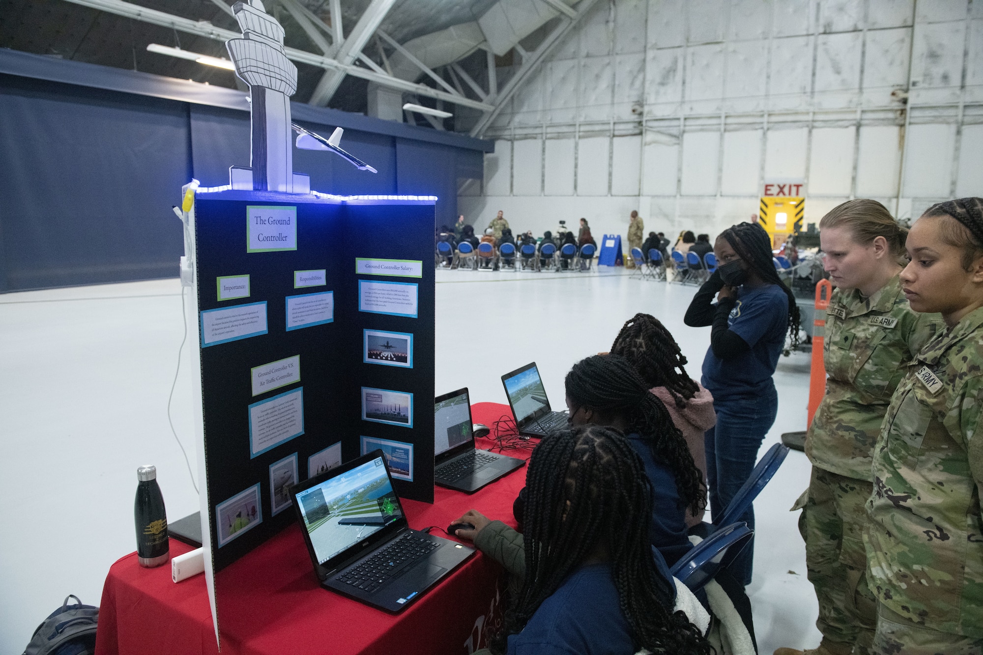 U.S. Army air traffic controllers showcase a simulation of their job to students from the local area at Joint Base Andrews, Md., March 9, 2023. More than 300 students had the opportunity to participate in 14 activities related to Science, Technology, Engineering, Arts and Mathematics careers. (U.S. Air Force photo by Senior Airman Daekwon Stith)