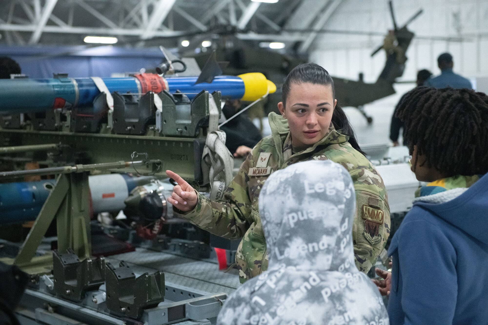U.S. Air Force Senior Airman Mistie McMakin, 53rd fighter squadron munitions technician, showcases training munitions to students during the Annual Aerospace Summit at Joint Base Andrews, Md., March 9, 2023. The summit featured 14 Science, Technology, Engineering, Arts and Math related workshops. (U.S. Air Force photo by Senior Airman Daekwon Stith)