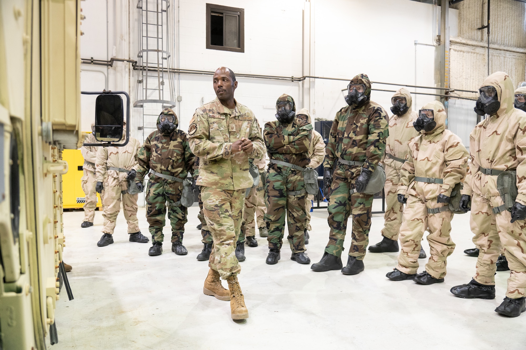 Master Sgt. Terrell Kelley, 436th Civil Engineer Squadron water and fuels system maintenance noncommissioned officer in charge, instructs Airmen on how to repel enemy attacks to their vehicle convoy during a readiness exercise at Dover Air Force Base, Delaware, March 7, 2023. The exercise tested the abilities of the 436th Airlift Wing to generate, employ and sustain airpower across the world in a contested and degraded operational environment. (U.S. Air Force photo by Mauricio Campino)