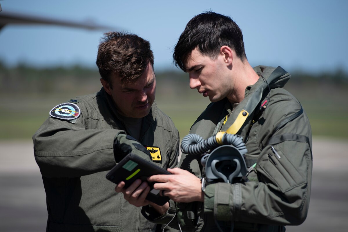 Lt. Col. Maxwell Harrell, 388th Fighter Wing inspector general, and Capt. Nicholas Gossner, 4th Fighter Squadron pilot, check F-35A Lightning II procedures after landing at Brunswick Golden Isles Airport in Brunswick, Ga., March 5, 2023. Harrell and Gossner performed some crew chiefs’ duties leaning into the multi-capable Airmen concept of accomplishing tasks outside of their core Air Force specialty. (U.S. Air Force photo by Tech. Sgt. Joshua Edwards)