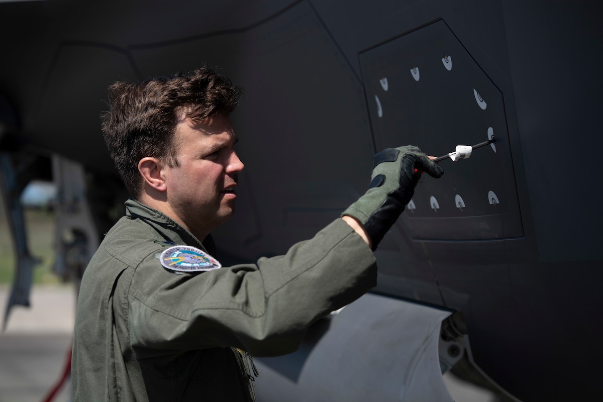 Lt. Col. Maxwell Harrell, 388th Fighter Wing inspector general, secures an F-35A Lightning II side panel prior to takeoff at Brunswick Golden Isles Airport in Brunswick, Ga., March 5, 2023. The 4th Fighter Squadron acted as the mission generation force element in a Lead Wing led by the 366th FW during exercise Agile Flag 23-1, Air Combat Command’s contributing certifying event for its Lead Wings throughout the Air Force Force Generation cycle. (U.S. Air Force photo by Tech. Sgt. Joshua Edwards)