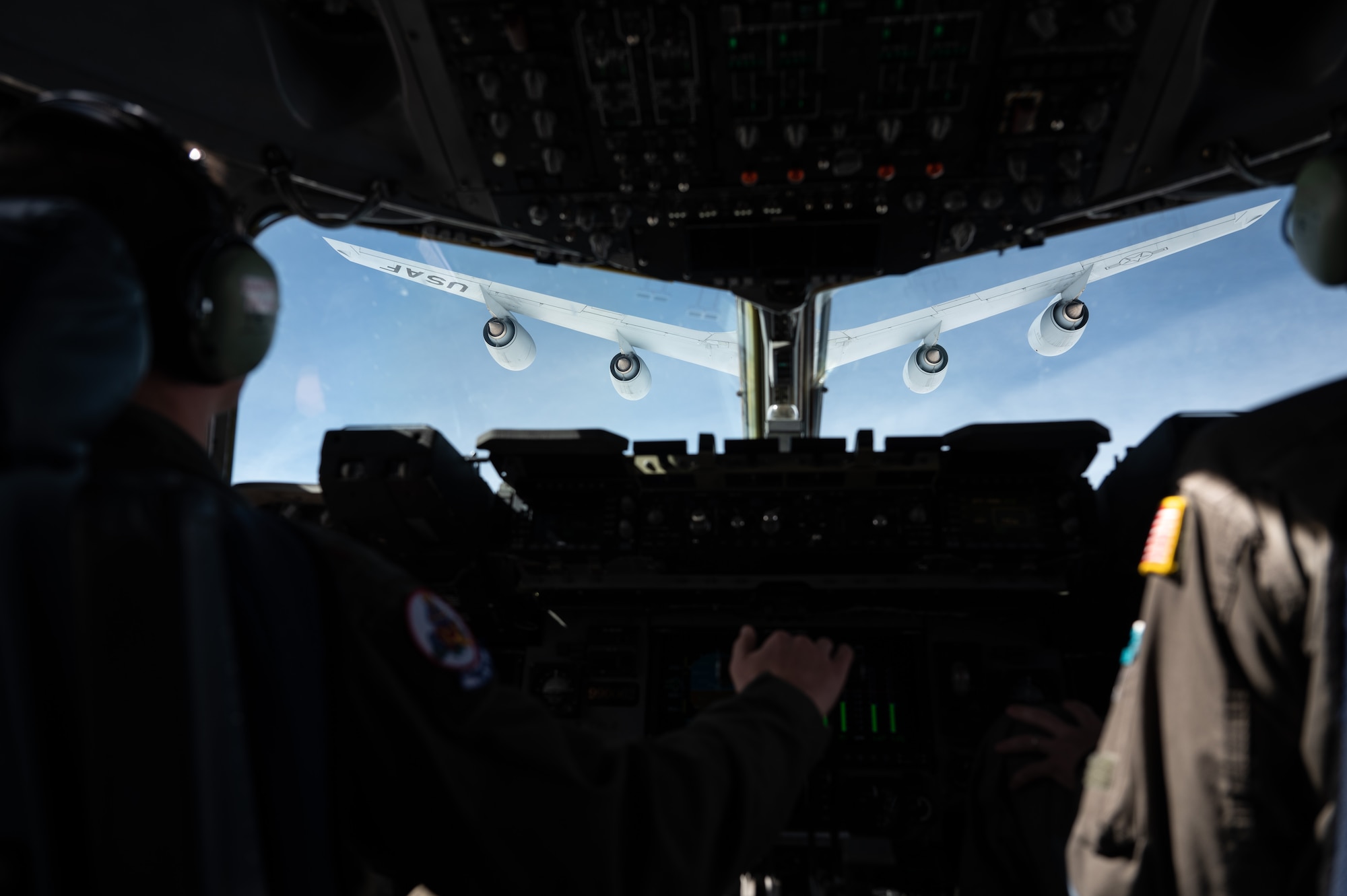 An Air Force Reserve C-17 Globemaster III aircrew, from Joint Base Charleston's 701st Airlift Squadron, refueled in mid-flight from the Kansas Air National Guard's 117th Air Refueling Squadron while flying westward over the Great Plains and Rocky Mountains, March 9, 2023. The Reserve aircrew trained on skills that couldn't easily be replicated locally at Charleston, such as flying over terrain, adverse weather, and aerial refueling including practicing emergency procedures. (U.S. Air Force photo by Tech. Sgt. Della Creech)