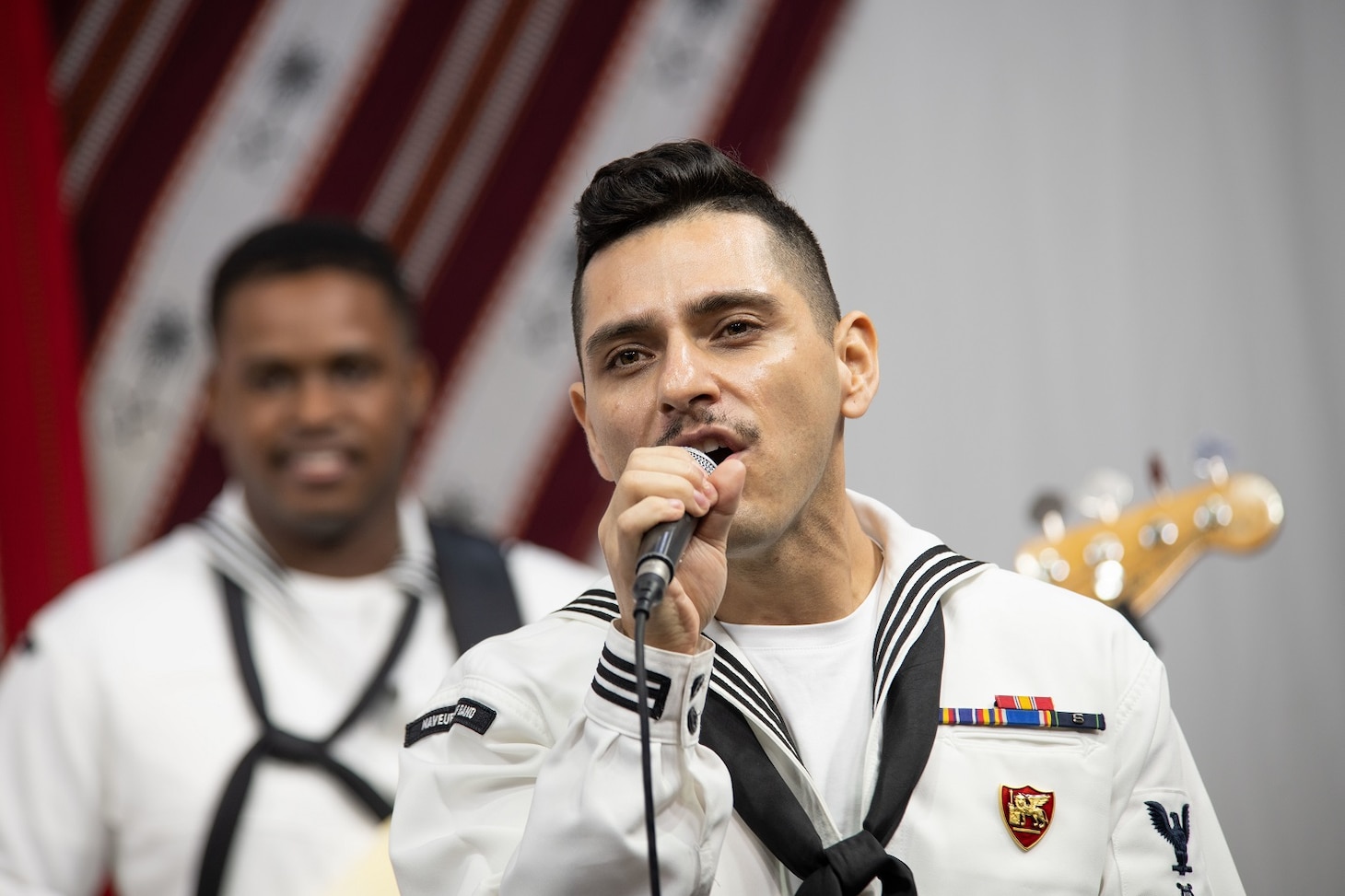 DJIBOUTI, Djibouti (March 7, 2023) - U.S Navy Musician Third Class Robert Novoa, lead vocalist, U.S. Naval Forces Europe and Africa Band, sings during a pre-recorded concert for Radio Television of Djibouti, (RTD); that will be broadcasted across Djibouti, March 7, 2023. Cutlass Express 2023, conducted by U.S. Naval Forces Africa (NAVAF) and sponsored by U.S. Africa Command (AFRICOM) is designed to assess and improve combined maritime law enforcement techniques, promote safety and security in the Western Indian Ocean, and increase interoperability between participating nations. U.S. Sixth Fleet, headquartered in Naples, Italy, conducts the full spectrum of joint and naval operations, often in concert with allied and interagency partners, in order to advance U.S. national interests and security and stability in Europe and Africa. (U.S. Navy photo by Mass Communication Specialist 1st Class Randi R. Brown)