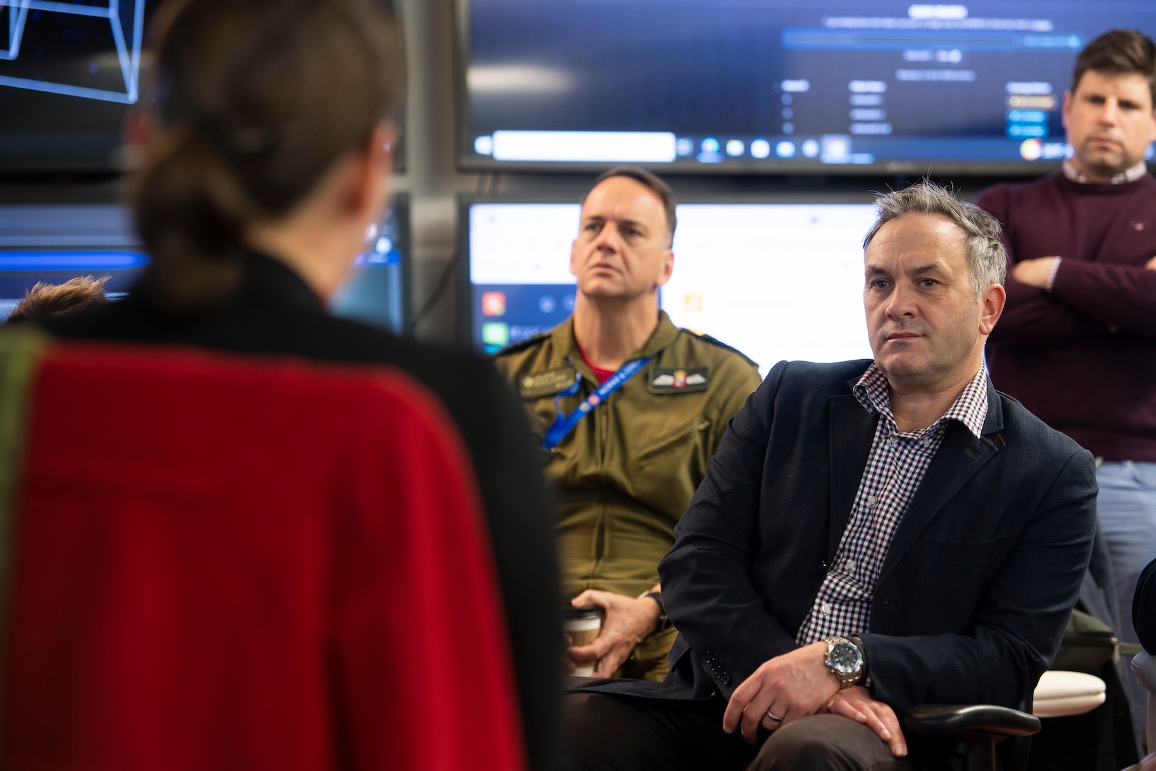 Man listens to briefing