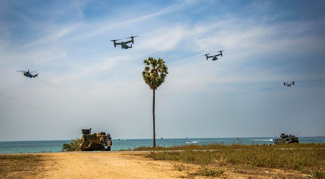 U.S. Marine Corps MV-22 Ospreys assigned to Marine Medium Tiltrotor Squadron (Rein.) 362, 13th Marine Expeditionary Unit, fly over multinational forces during an amphibious exercise as part of Exercise Cobra Gold 23 in Chonburi province, Kingdom of Thailand, March 3, 2023. Participating nations conducted operations simultaneously across multiple locations to refine command and control processes while fostering interoperability. Cobra Gold, now in its 42nd year, is a Thai-U.S. co-sponsored training event that builds on the long-standing friendship between the two allied nations and brings together a robust multinational force to promote regional peace and security in support of a free and open Indo-Pacific. (U.S. Marine Corps photo by Gunnery Sgt. Chad J. Pulliam)