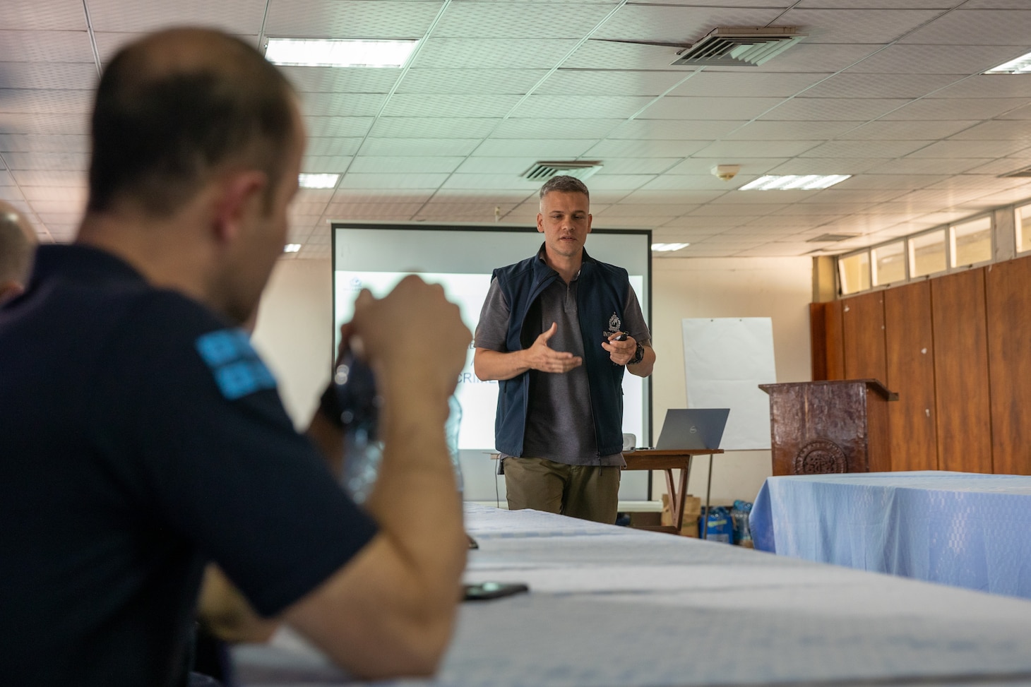230307-N-FV745-1068 RAVLUNDA, Sweden (June 7, 2022) A International Criminal Police Organization (INTERPOL) agent discusses training items with members of the Georgian Coastguard Service members and members of the Mauritius Police Force (MPF) during exercise Cutlass Express 23, March 7, 2022. Cutlass Express 2023, conducted by U.S. Naval Forces Africa (NAVAF) and sponsored by U.S. Africa Command (AFRICOM) is designed to assess and improve combined maritime law enforcement techniques, promote safety and security in the Western Indian Ocean, and increase interoperability between participating nations. U.S. Sixth Fleet, headquartered in Naples, Italy, conducts the full spectrum of joint and naval operations, often in concert with allied and interagency partners, in order to advance U.S. national interests and security and stability in Europe and Africa. (U.S. Navy photo by Mass Communication Specialist 1st Class Daniel James Lanari/Released)
