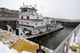 A tow boat navigates the Mississippi River.