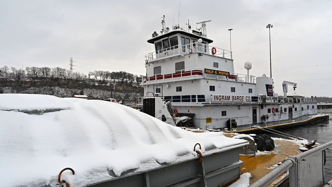 A tow boat navigates the Mississippi River.