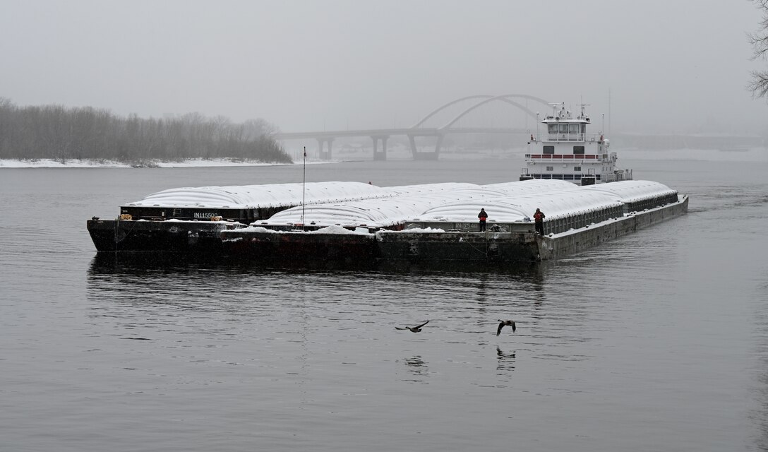 A tow boat navigates the Mississippi River.