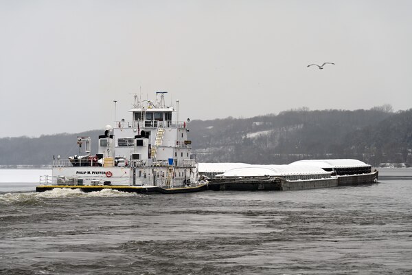 A tow boat navigates the Mississippi River.