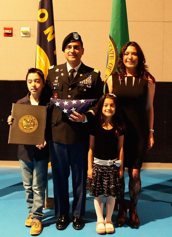 Rudy Valentin, a retired Army lieutenant colonel, currently serves as the workforce management specialist with Logistics Readiness Center Italy, 405th Army Field Support Brigade, in Vicenza, Italy. Valentin was recently selected as LRC Italy’s employee of the quarter (senior-graded) for the 1st quarter of fiscal year 2023. Pictured here, Valentin and his family are honored and recognized at his retirement ceremony following 27 years of active-duty Army service. (U.S. Army courtesy photo)