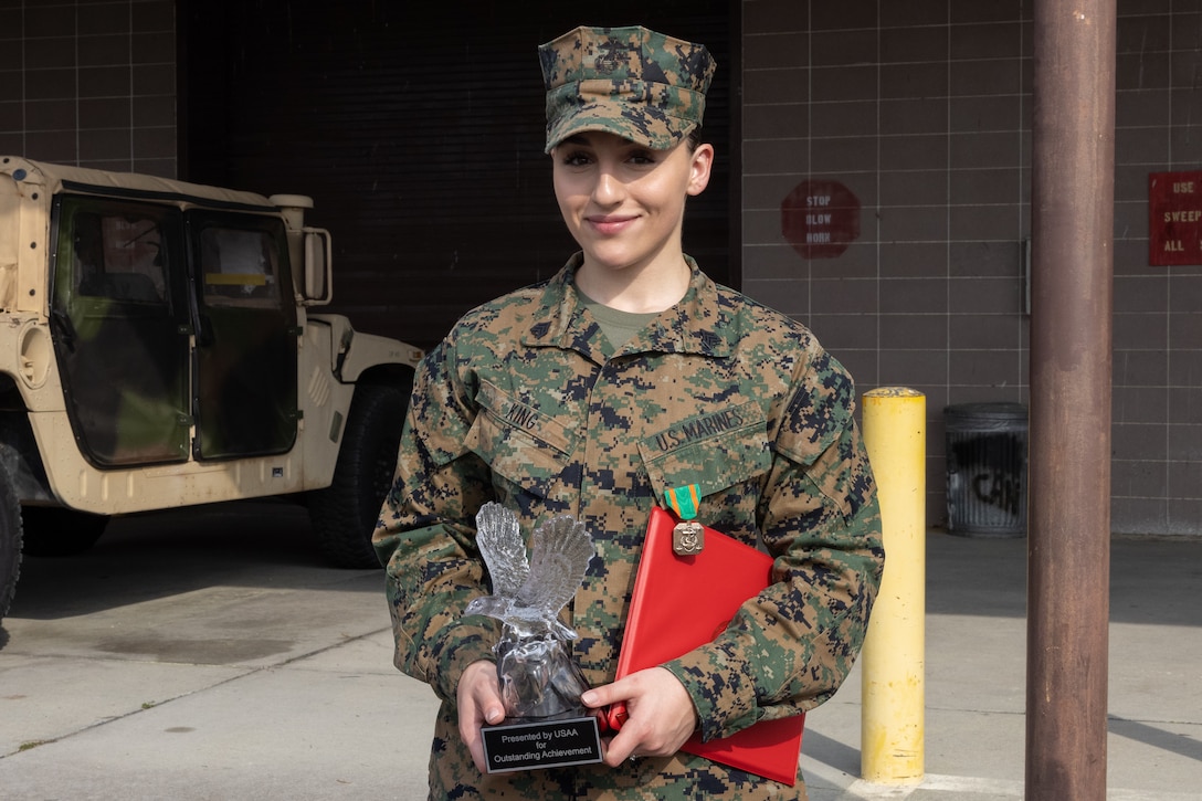 U.S. Marine Corps Sgt. Lorita King, an administrative specialist with Marine Air Control Group (MACG) 28, poses for a photo after an awards ceremony at Marine Corps Air Station Cherry Point, North Carolina, March 3, 2023. King was recognized as the 2nd Marine Aircraft Wing (MAW) 2022 noncommissioned officer of the year for her exemplary work ethic. MACG-28 is a subordinate unit of 2nd MAW, the aviation combat element of II Marine Expeditionary Force. (U.S. Marine Corps photo by Lance Cpl. Orlanys Diaz Figueroa)