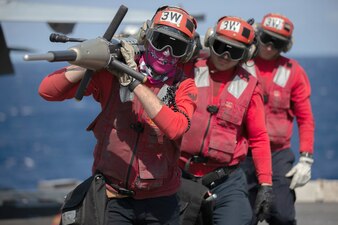 Sailors unload unload ordnance aboard USS Gerald R. Ford (CVN 78).