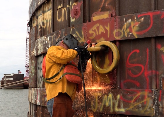Kentucky Lock and Dam Operator and Maintenance Mechanic Adam Halcom welds mooring cells March 8, 2023, while repairing the rings for future use by vessels waiting to lock through Kentucky Lock in Grand Rivers, Kentucky. (USACE Photo by Misty Cunningham)