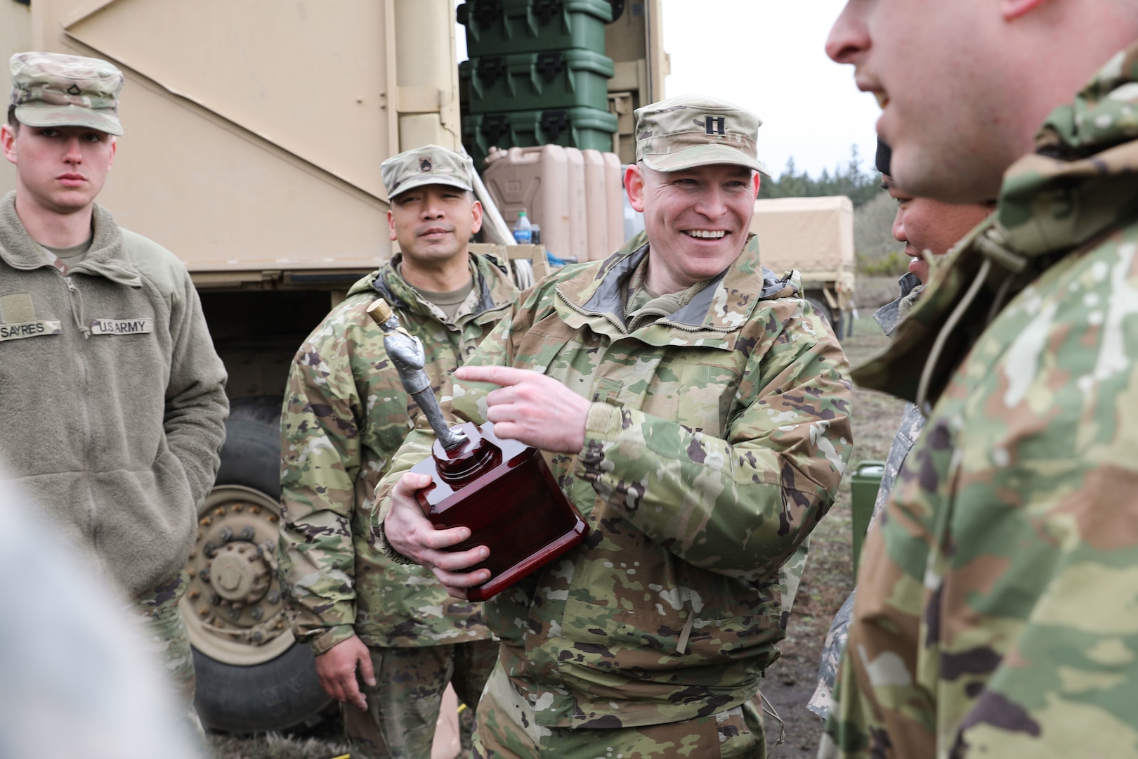 U.S. Army Capt. Jacob Guenther, commander of Delta Company, 141st Brigade Support Battalion, 96th Troop Command, talks with members of his company after being presented the Washington Army National Guard Culinary Award at Joint Base Lewis-McCord, Wash., March 4, 2023. The company will move on to regionals which will be a timed, two-day event.