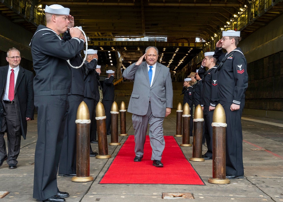 Secretary of the Navy Carlos Del Toro is pipped ashore following an all-hands call aboard the Harpers Ferry-class dock landing ship USS Carter Hall (LSD 50), at Joint Expeditionary Base Little Creek-Fort Story, March 10, 2023.