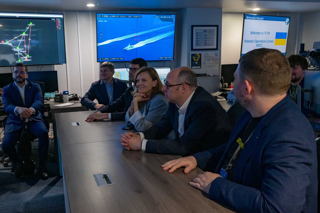 MANAMA, Bahrain (March 13, 2023) Members of a Ukrainian delegation, including Ambassador of Ukraine to the United Arab Emirates Dmytro Senik, center right, listens to a briefing by U.S. 5th Fleet’s Task Force 59 during a visit to the Robotics Operations Center in Manama, Bahrain, March 13, 2023.