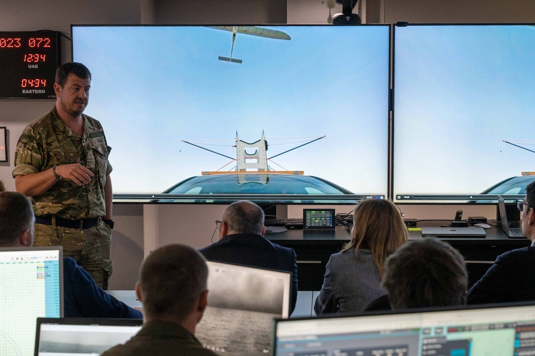 MANAMA, Bahrain (March 13, 2023) United Kingdom Royal Navy Capt. Jim Lovell, deputy commander of U.S. 5th Fleet’s Task Force 59, briefs members of a Ukrainian delegation during a visit to the Robotics Operations Center in Manama, Bahrain, March 13, 2023.