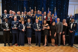 A large group of people pose for a photo.