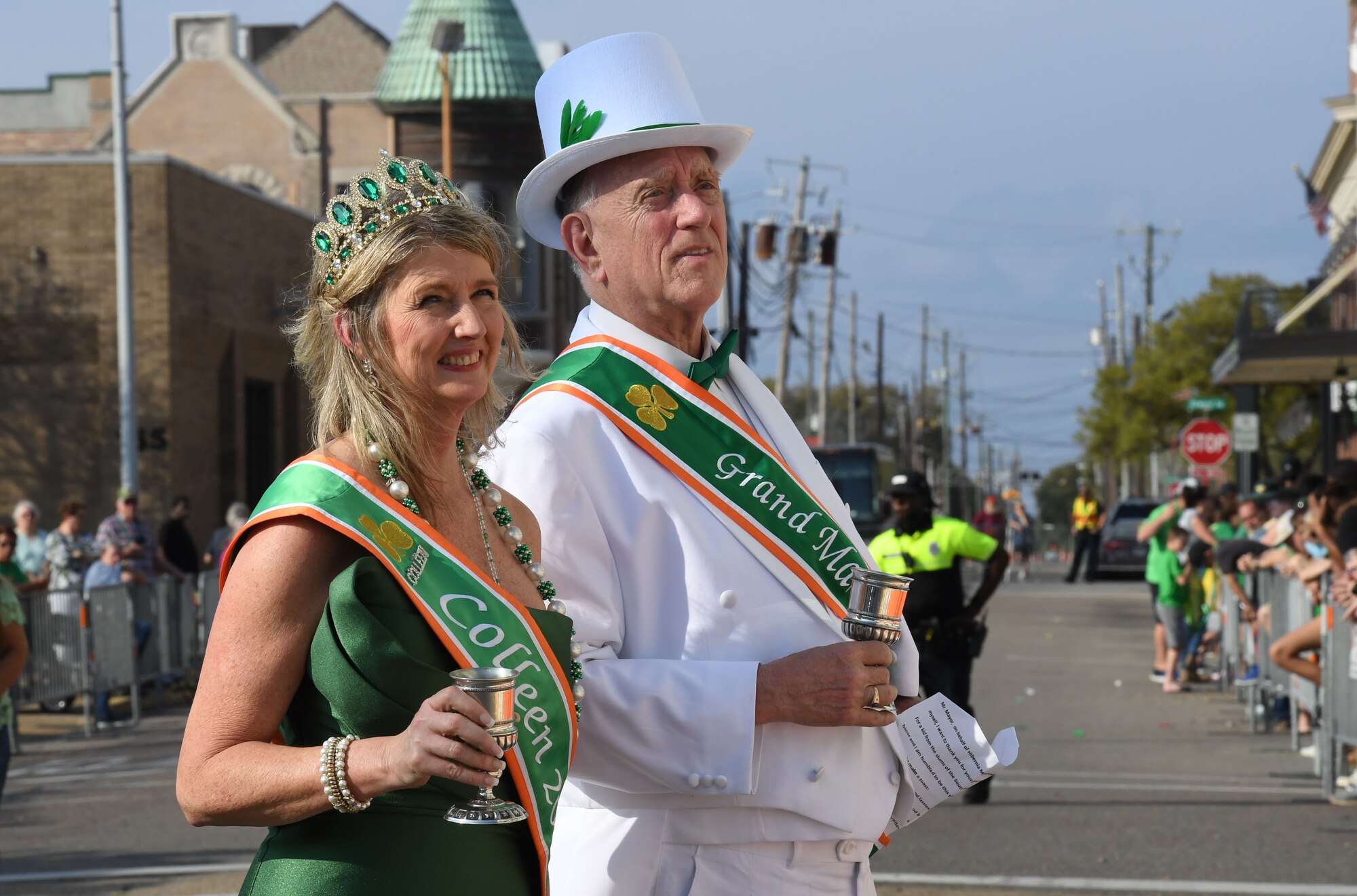 Stacy Thunelius, 2023 Colleen, and Charles Nannery, 2023 Grand Marshal, prepare to make a toast during the Hibernia Marching Society of Mississippi St. Patrick's Day Parade in Biloxi, Mississippi, March 11, 2023.