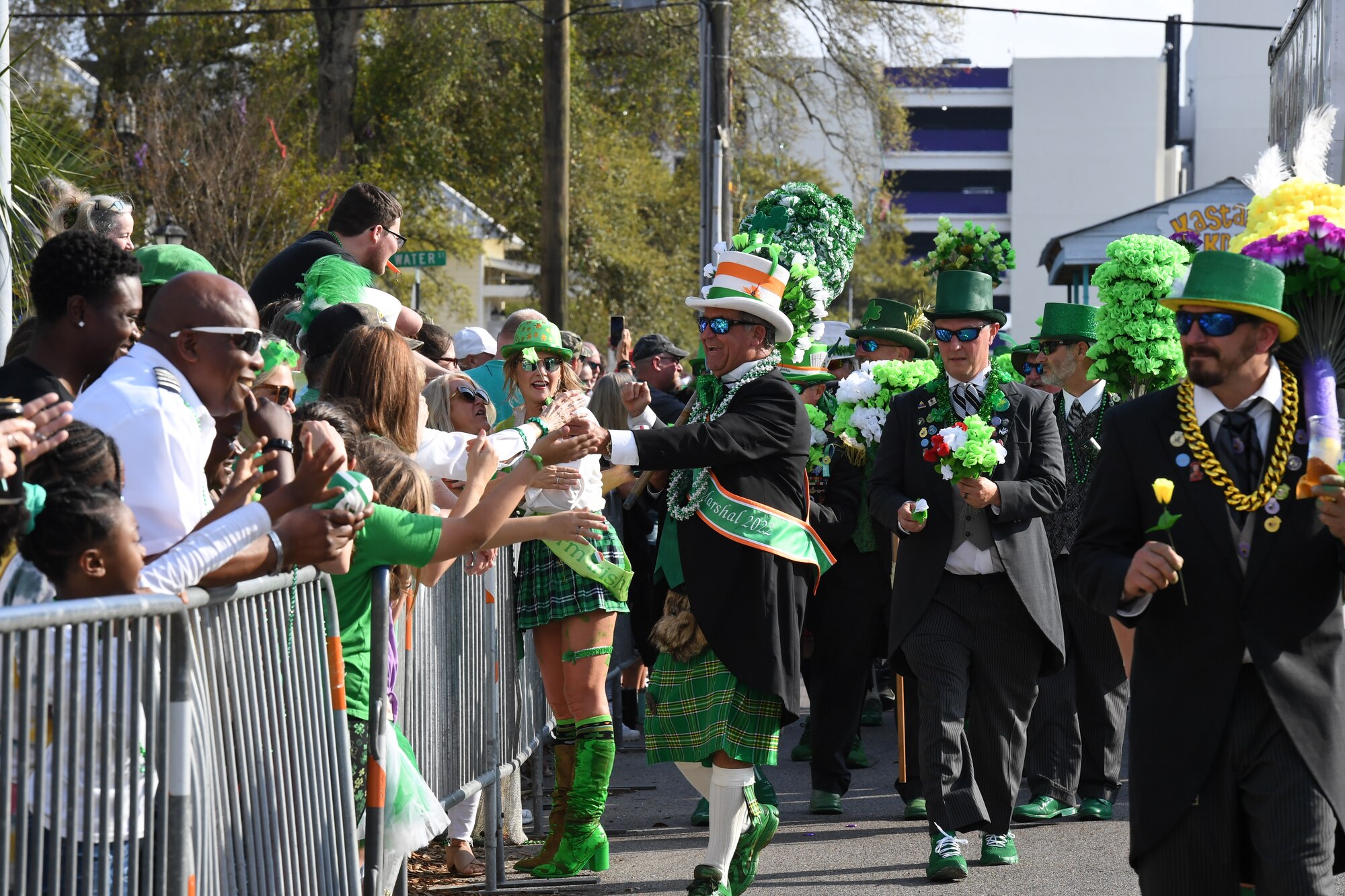 Members of the Ole Biloxi Marching Club participate in the Hibernia Marching Society of Mississippi St. Patrick's Day Parade in Biloxi, Mississippi, March 11, 2023.