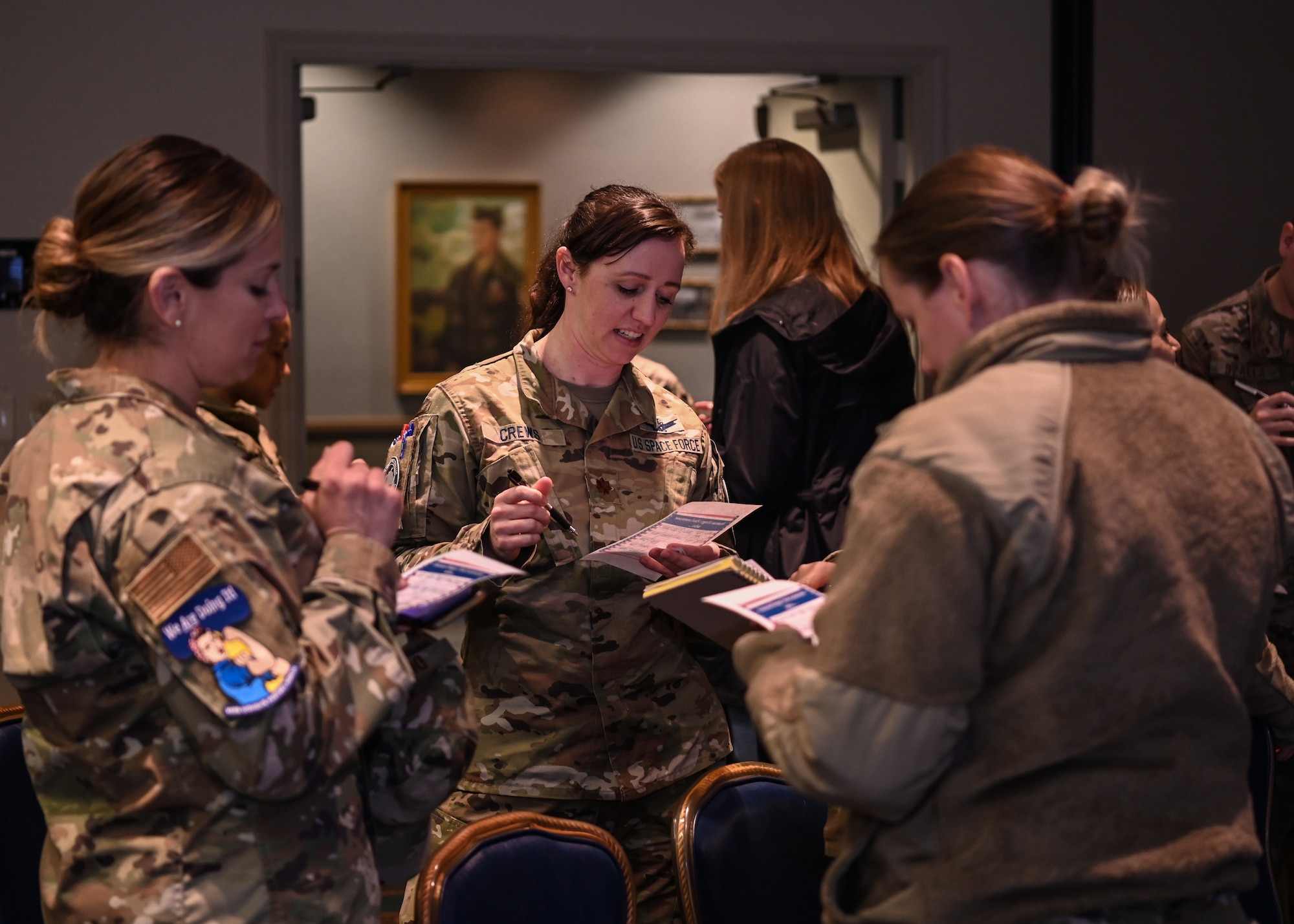 The Women of Vandenberg Empowerment Network recently hosted their first event for Women's History Month at Vandenberg Space Force Base, Calif., March 10, 2023. Members of team Vandenberg collaborated to get to know unique things  about one another during a game of bingo at the WoVEN kick-off event. (U.S. Space Force photo by Senior Airman Tiarra Sibley)