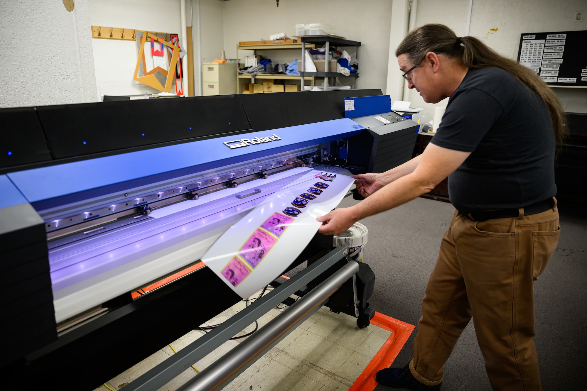 Lorn Fant, 75th Force Support Squadron, prints stickers at the Arts and Crafts Center, Hill Air Force Base, Utah, Feb. 28, 2023. The center offers a variety of products, creative services and classes to learn new crafts to the base community. (U.S. Air Force photo by R. Nial Bradshaw)