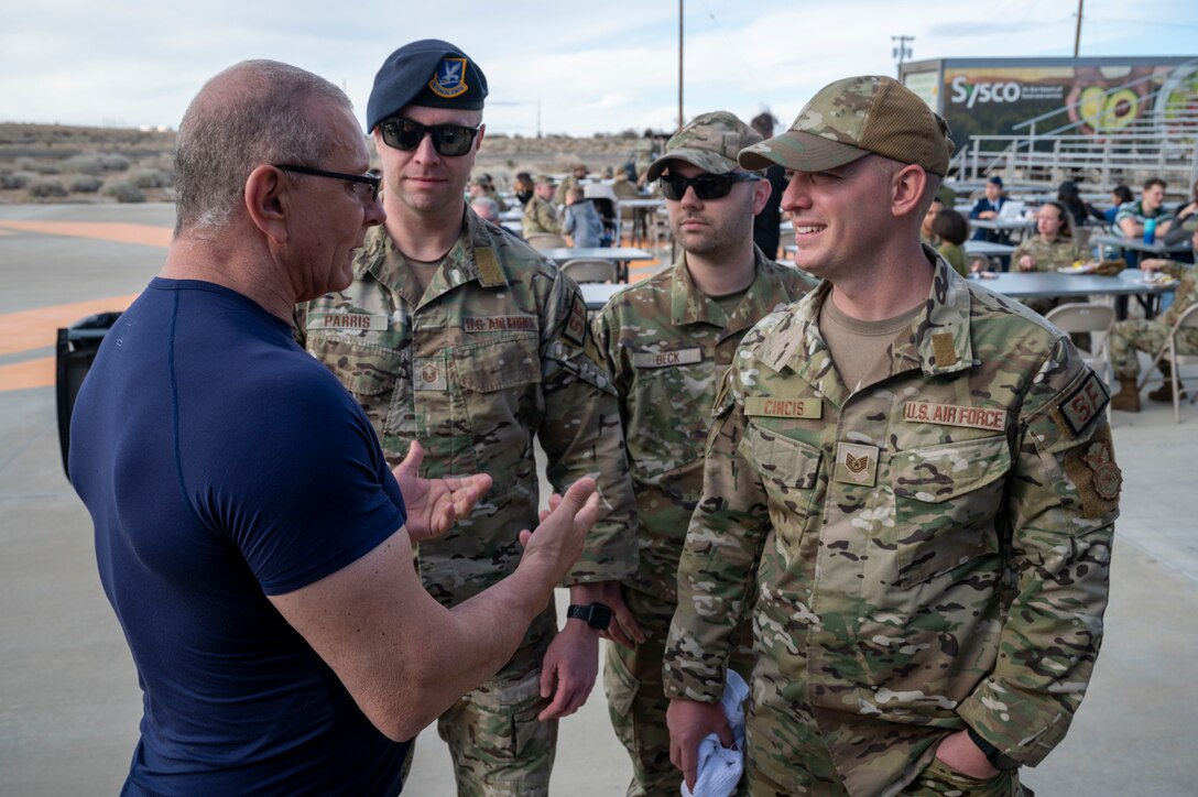Celebrity Chef Robert Irvine speaks to 412th Security Forces Airmen during the Breaking Bread for Heroes event at Edwards Air Force Base, California, March 10.