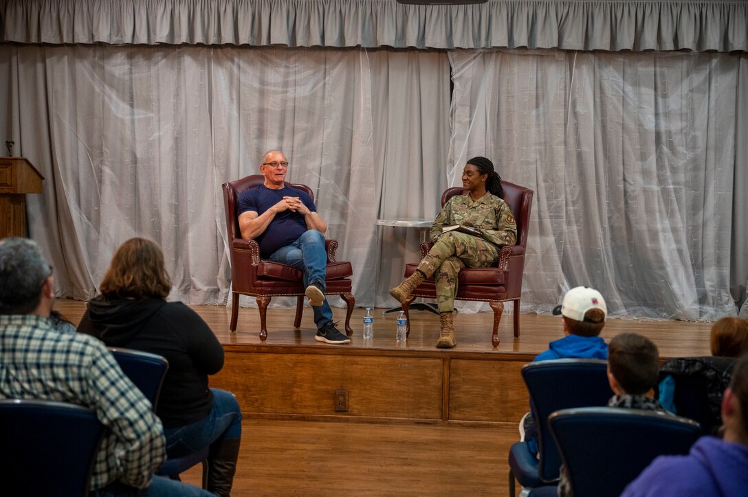 CMSgt. Denisha Ward-Swanigan, Command Chief Master Sergeant, 412th Test Wing emcees the Conversation with Celebrity Chef Robert Irvine event with base personnel at Edwards Air Force Base, California, March 10.