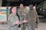 Col. Lisa Rennard, commander, 403rd Army Field Support Brigade discusses Powerhouse Brigade capabilities with Maj. Gen. David Wilson, commanding general, U.S. Army Sustainment Command, and Command Sgt. Maj. Jorge Escobedo, ASC command sergeant major, during the ASC Command Team’s battlefield circulation visit to South Korea, Feb. 28 to March 2.