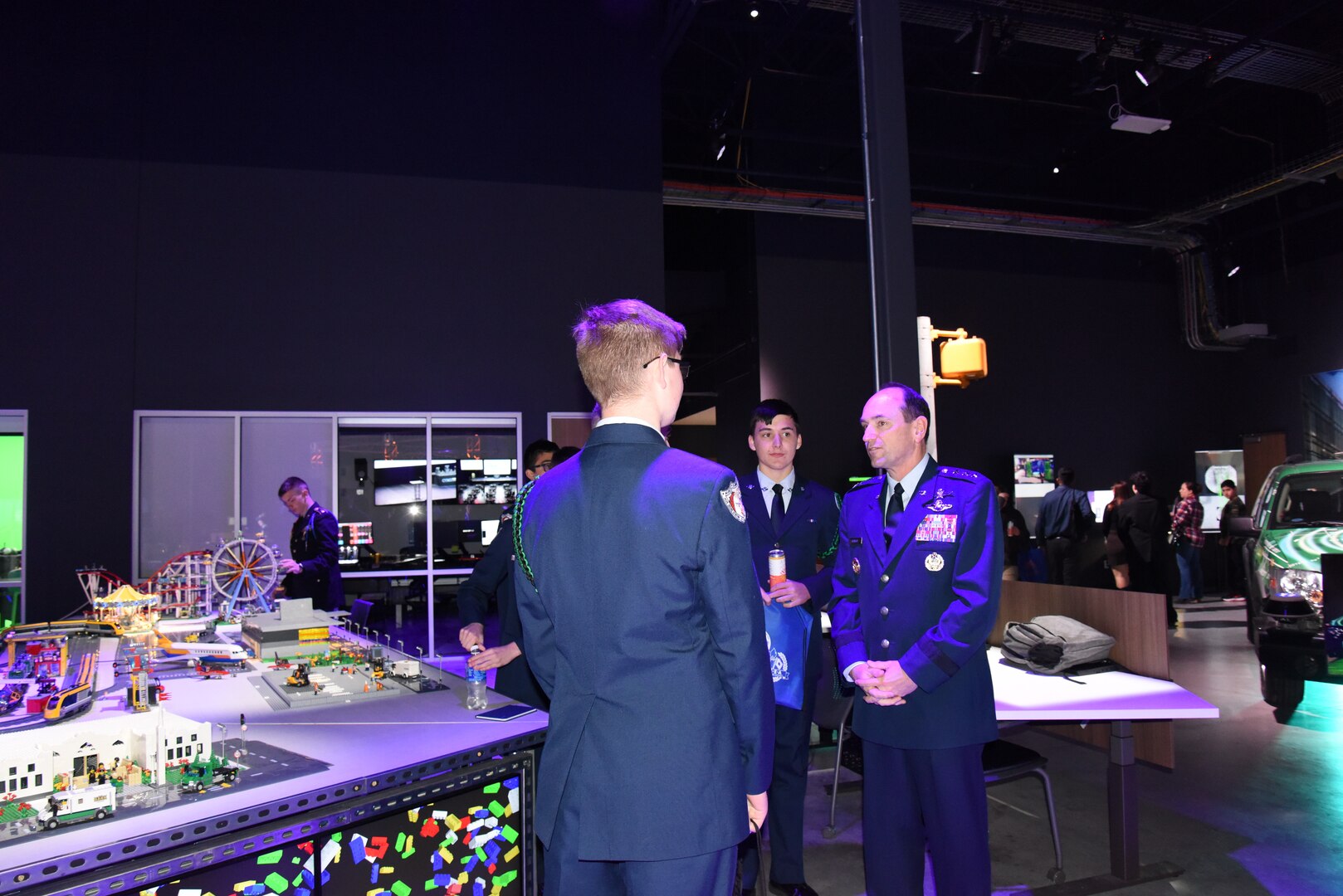 Lt Gen Kevin Kennedy, commander 16 Air Force (AFCYBER,) talks with Jr ROTC  cadets at the San Antonio Mayor's Cyber Cup College Fair prior to the Awards Luncheon, Saturday, Feb 25.