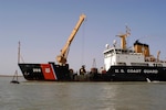 Coast Guard Cutter Walnut, a buoy tender homeported in Honolulu and deployed to the Persian Gulf in February 2003, performs aids to navigation work. The cutter arrived in the Persian Gulf Feb. 27, 2003 to support U.S. Naval Forces Central Command during Operation Iraqi Freedom. (Coast Guard Collection)