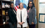 Photo of three women smiling.