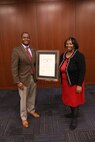 Naval Surface Warfare Center, Philadelphia Division Activity Security Manager Dorothy Morton is presented with a career service award for 50 years of government service by Technical Director Nigel C. Thijs during the NSWCPD Fiscal Year 2023 Quarterly Awards Ceremony on Feb. 27, 2023. (U.S. Navy photo by Sgt. Jermaine Sullivan/Released)