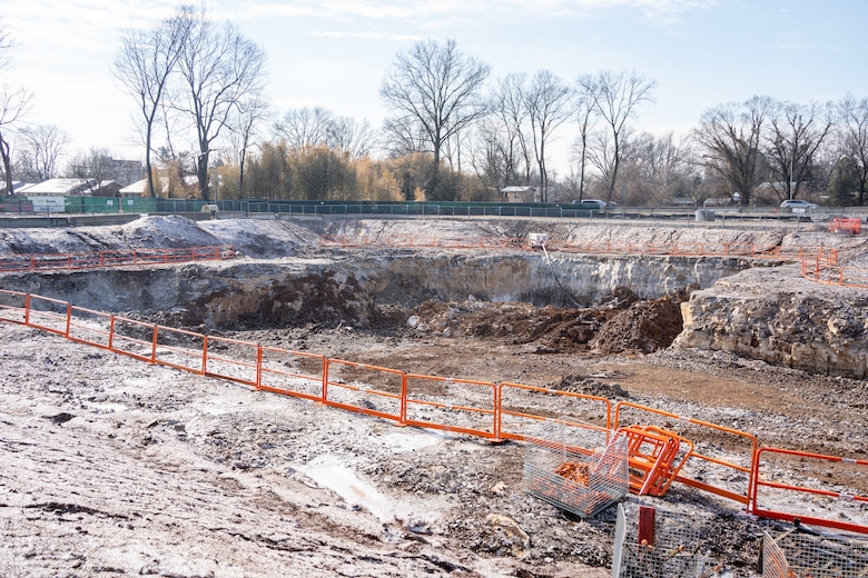 This photo shows a large pit that was dug into the granite rock layer of the earth on the construction site.