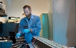 Christopher Depuma, U.S. Naval Research Laboratory electronics engineer, conducts a functional test of the laser power beaming link on Space Wireless Energy Laser Link (SWELL) at Washington, D.C. April 3, 2022. SWELL will launch aboard the DoD Space Test Program-H9 payload (STP-H9) to the International Space Station in January 2023, where it will then be powered on and operate for one to two years. SWELL will be the first on-orbit demonstrations of Laser Power Beaming. (U.S. Navy photo by Jonathan Sunderman)