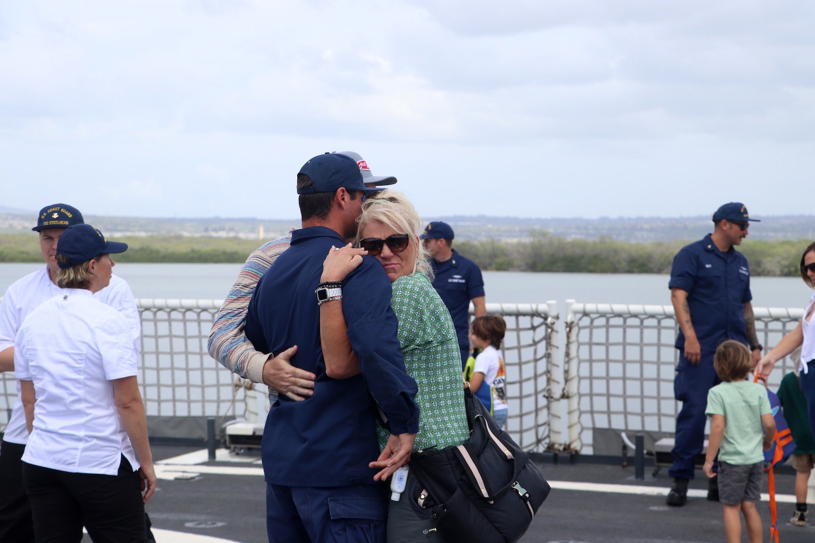 U.S. Coast Guard Cutter Kimball (WMSL 756) crew members reunite with family members as Kimball returns to Honolulu following a 42-day Western Pacific patrol, March 10, 2023. Kimball was the first U.S. military ship in recent history to visit the port city of Kagoshima, Japan, during their patrol where the crew partnered with servicemembers from Japan Coast Guard’s 10th District to plan and conduct combined operations and search-and-rescue exercises. U.S. Coast Guard photo by Ens. Philip Rogers.