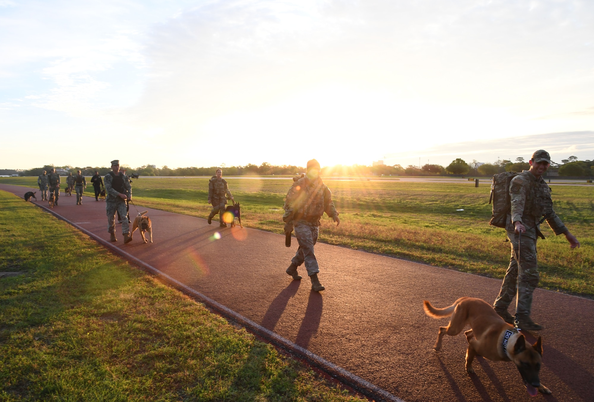 Members of the 81st Security Forces Squadron and the Naval Construction Battalion Center Gulfport participate in the K-9 Veteran's Day Ruck & Demonstration at Keesler Air Force Base, Mississippi, March 13, 2023.