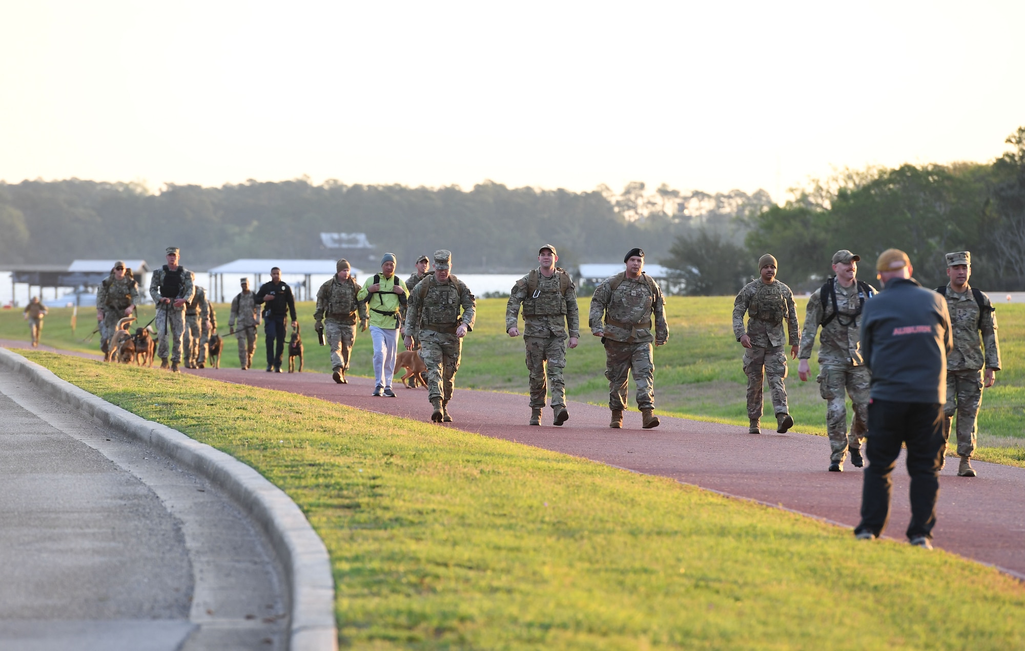 Members of the 81st Security Forces Squadron and the Naval Construction Battalion Center Gulfport participate in the K-9 Veteran's Day Ruck & Demonstration at Keesler Air Force Base, Mississippi, March 13, 2023.