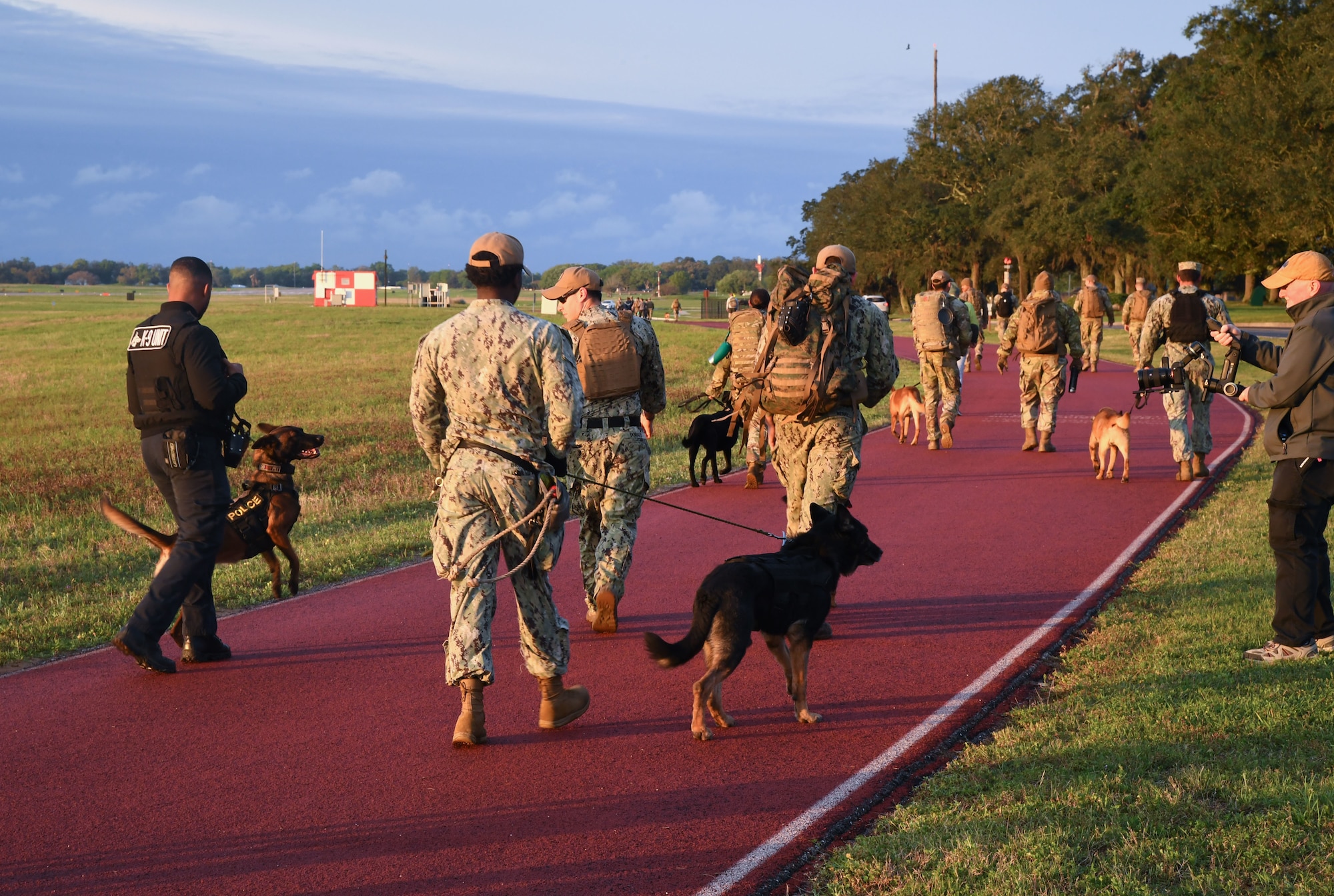 Members of the 81st Security Forces Squadron and the Naval Construction Battalion Center Gulfport participate in the K-9 Veteran's Day Ruck & Demonstration at Keesler Air Force Base, Mississippi, March 13, 2023.