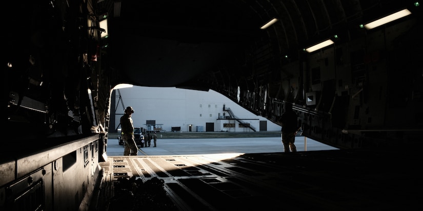Airmen assigned to the 305th Aerial Port Squadron and 87th Logistics Readiness Squadron fuels management flight prepare to load a R-11 fuel truck onto a C-17 Globemaster during exercise White Stag at Joint Base McGuire-Dix-Lakehurst, N.J., Mar. 9. 2023.