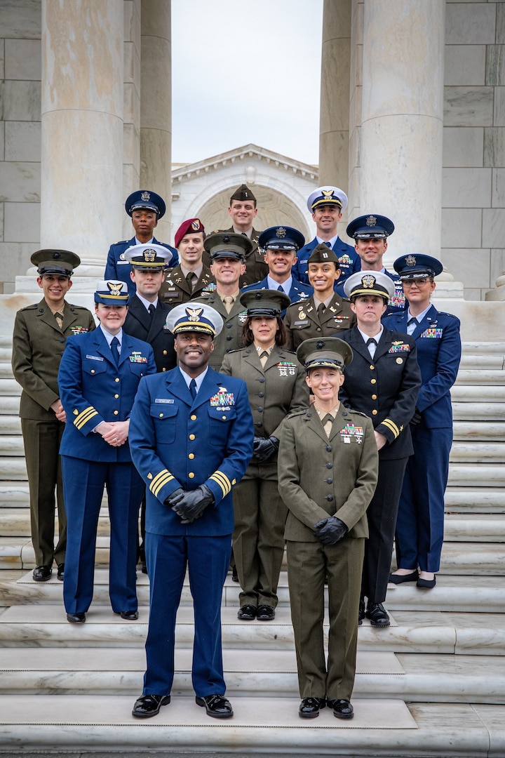 The 2023 U.S. Senate Youth Program military mentors pose for a photo at Arlington National Cemetery March 10, 2023, following a visit to the Tomb of the Unknown Soldier. Seventeen military officers from across the Department of Defense served as mentors for the 61st iteration of the USSYP, to serve as role models for the 104 student delegates, two from each state, the District of Columbia, and the Department of Defense Education Activity, who participated. (Courtesy photo)