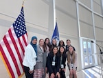Maj. Holli Nelson (back right) poses with delegates from the 61st United States Senate Youth Program at the United States Institute of Peace in Washington, D.C. March 7, 2023. Nelson served as one of 17 military mentors charged with providing support and mentoring to 104 delegates from across the United States, District of Columbia and the Department of Defense Education Activity. (Courtesy Photo)