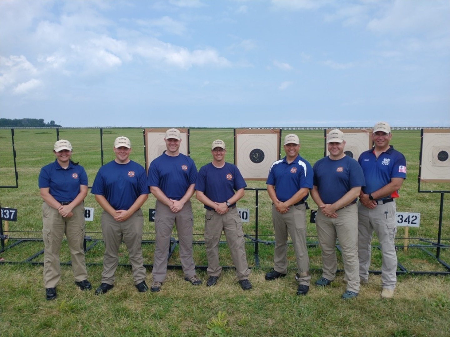 The Coast Guard’s Marksmanship Team poses for a photograph after competing in the National Trophy Pistol Match at the Civilian Marksmanship Program National Matches in Camp Perry, Ohio in July 2022. The team consisted of members all throughout the Coast Guard: (L to R) Petty Officer 3rd Class Christina MacMillan, Petty Officer 2nd Class Brent Craemer, Cmdr. Jonathan Welch, Chief Petty Officer Charlie Petrotto, Chief Petty Officer Mark Osborne, Capt. David Melton, Chief Petty Officer Wesley Koran.