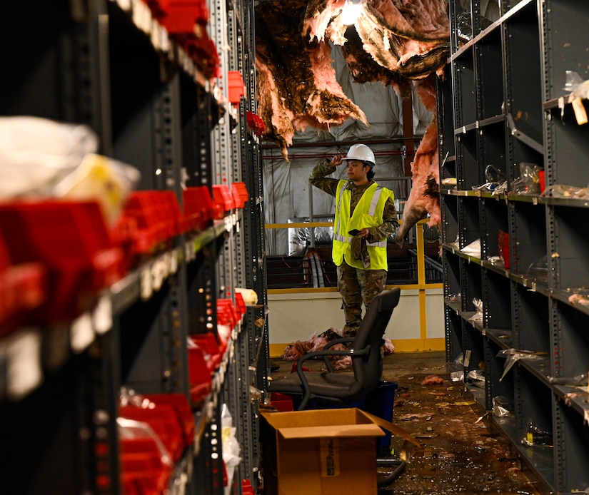 Airmen clear equipment from building 777 after a structural fire.