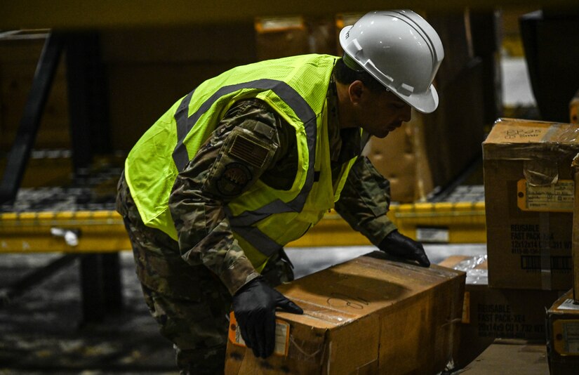 Airmen clear equipment from building 777 after a structural fire.