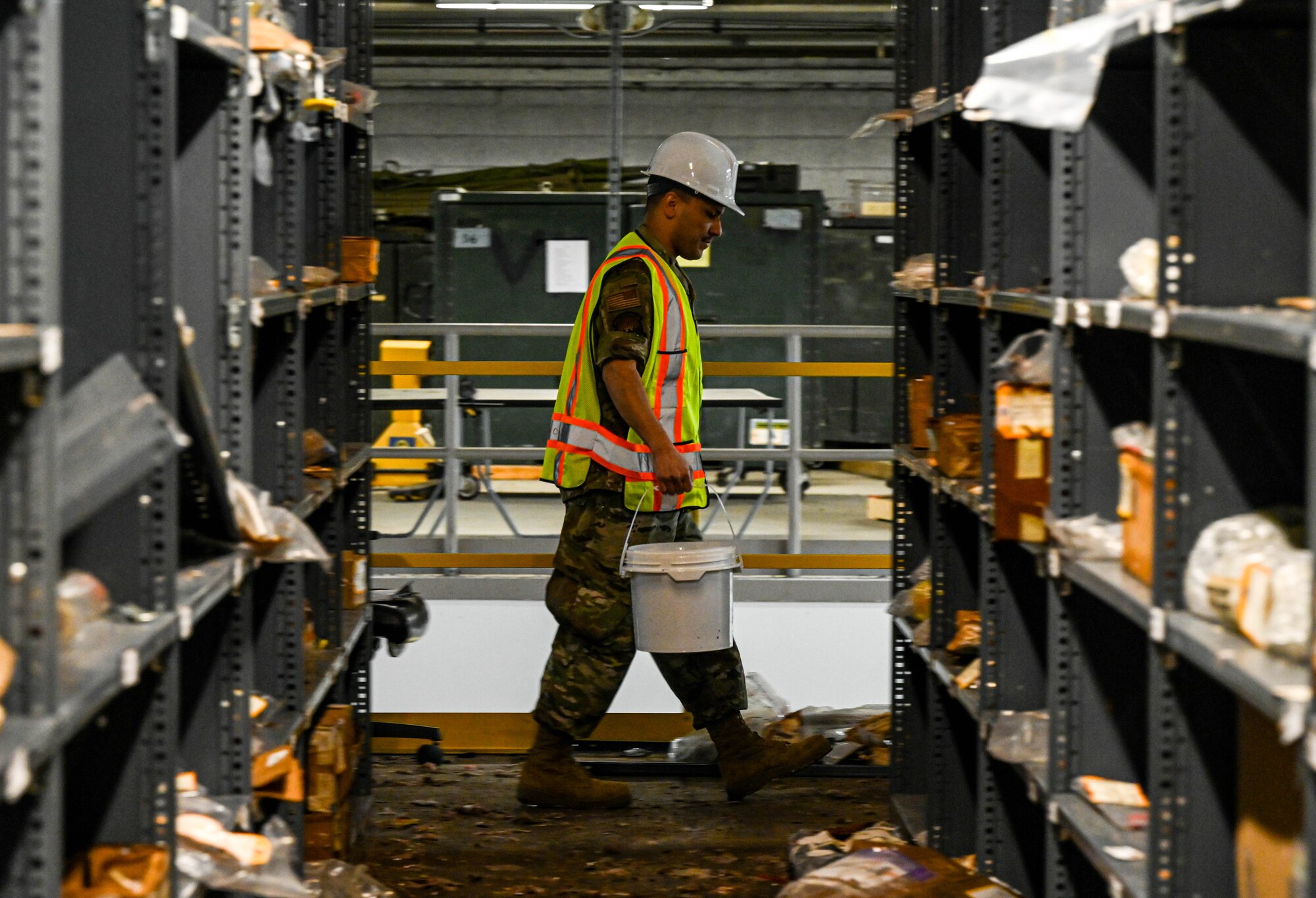 Airmen clear equipment from building 777 after a structural fire.
