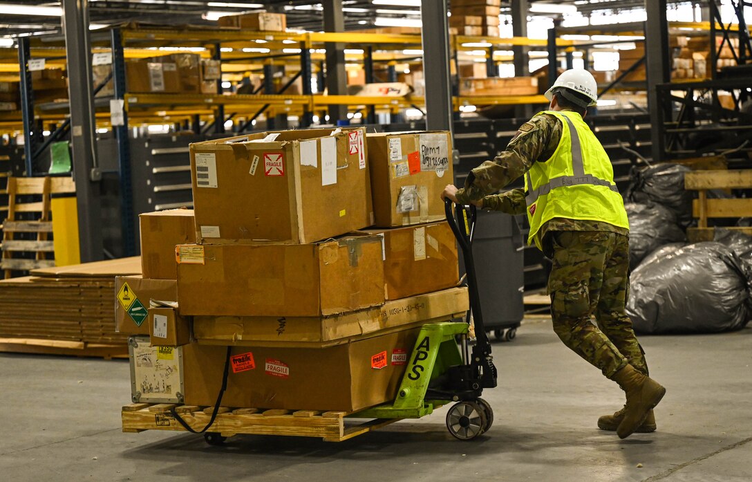 Airmen clear equipment from building 777 after a structural fire.